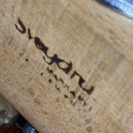 Load image into Gallery viewer, Close-up of a wooden surface with SVEGARD BRANDING
