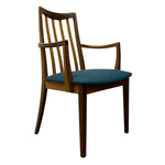 Load image into Gallery viewer, A mid-century modern wooden dining chair with a slatted backrest, curved armrests, and a teal blue upholstered seat cushion, shown against a plain white background.

