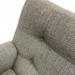 Load image into Gallery viewer, Close-up of a textured upholstered armchair corner in a warm taupe-gray fabric, shown against a white background with a soft shadow underneath.
