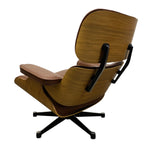 Load image into Gallery viewer, A mid-century modern lounge chair with a curved wooden shell, brown leather cushions, and a black five-star swivel base, shown from a three-quarters angle on a white background.
