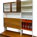 Load image into Gallery viewer, Wooden and white bookshelf with glass panels and orange storage bins on a white background
