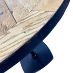 Load image into Gallery viewer, Wooden table with a dark metal base on a white background
