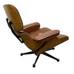 Load image into Gallery viewer, A mid-century modern lounge chair with a brown leather seat and backrest, mounted on a curved wooden shell with a black five-star base, shown against a plain white background.
