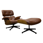 Load image into Gallery viewer, A mid-century modern lounge chair with matching ottoman in brown leather, featuring a curved wooden shell, tufted headrest, and black swivel star base on a white background.
