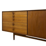 Load image into Gallery viewer, Mid-century modern wooden sideboard with five drawers on the left, a large cabinet door on the right, and tapered legs, shown against a plain white background.
