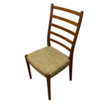 Load image into Gallery viewer, Wooden chair with a woven seat on a white background
