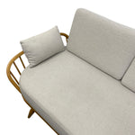 Load image into Gallery viewer, cream sofa with wooden frame and matching pillow on a white background
