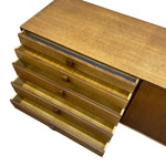 Load image into Gallery viewer, Mid-century modern wooden credenza or sideboard with four open drawers showing a light wood interior and brass pull handles, photographed on a white background.
