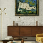 Load image into Gallery viewer, Modern living room with wooden sideboard, yellow armchair, and abstract painting on white brick wall.
