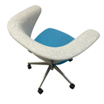 Load image into Gallery viewer, Modern chair with white curved backrest and blue seat on a white background
