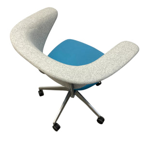 Modern chair with white curved backrest and blue seat on a white background