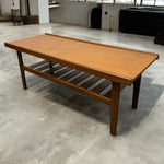 Load image into Gallery viewer, Wooden coffee table on a concrete floor with a minimal background
