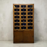 Load image into Gallery viewer, HABERDASHERY WITH TWENTY ONE DRAWERS ON A CONCRETE FLOOR

