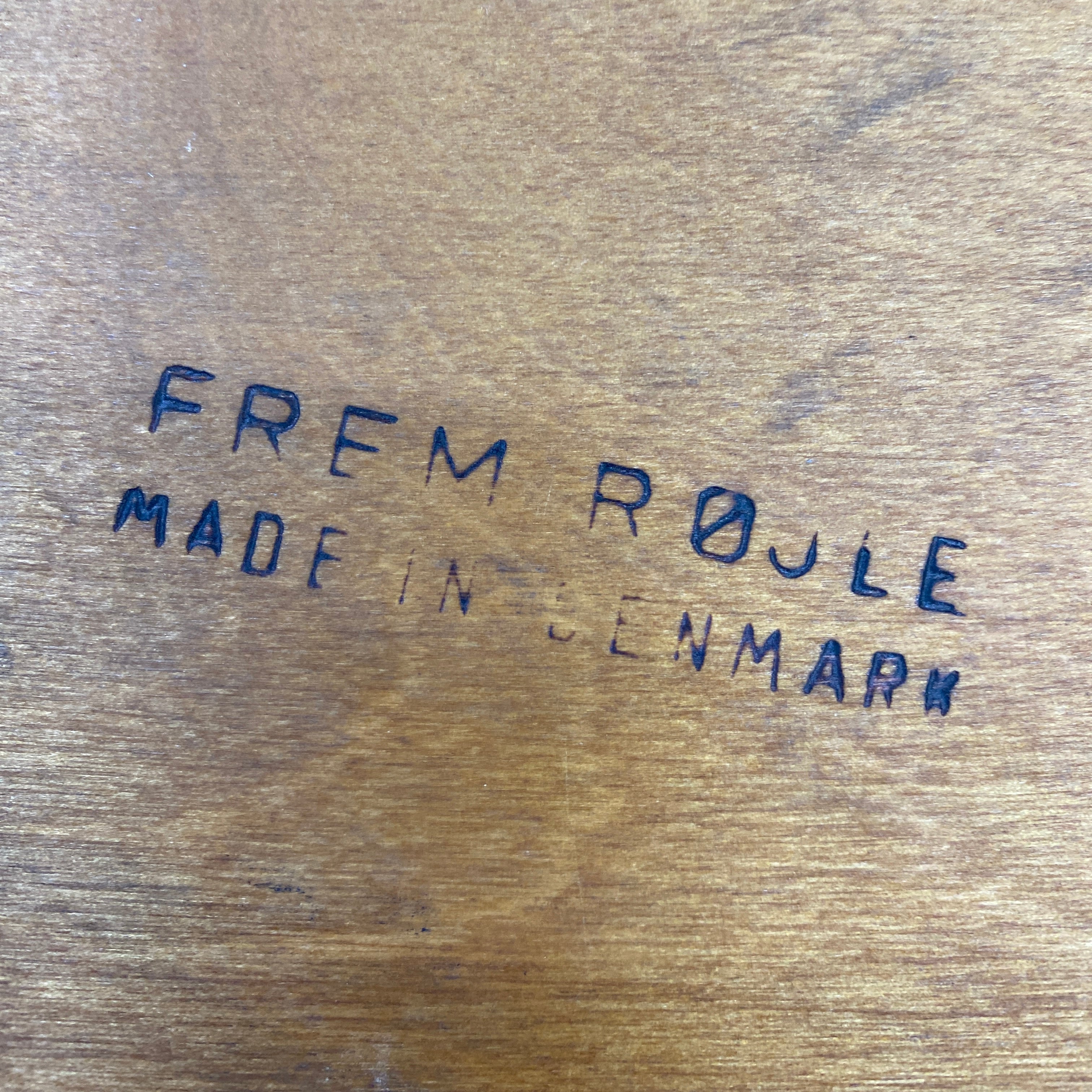 Wooden surface with 'Frem Røjle Made in Denmark' text.