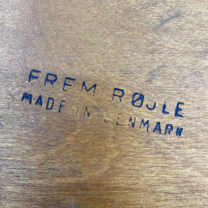 Wooden surface with 'Frem Røjle Made in Denmark' text.