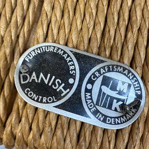 Metallic label on woven material with 'Furniture Makers' Danish Control' text
