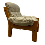 Load image into Gallery viewer, side of a cream leather chair
