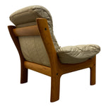 Load image into Gallery viewer, back of a cream leather chair
