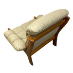 Load image into Gallery viewer, back of a cream leather chair
