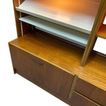 Load image into Gallery viewer, Wooden shelf unit with white and orange shelves on a white background
