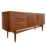 Load image into Gallery viewer, Wooden sideboard with drawers and doors on a white background
