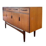 Load image into Gallery viewer, Wooden sideboard with drawers and doors on a white background
