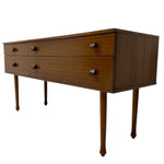 Load image into Gallery viewer, Wooden dresser with four drawers on a white background
