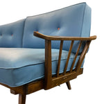 Load image into Gallery viewer, Blue upholstered chair with wooden armrests on a white background

