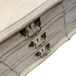 Load image into Gallery viewer, Close-up of a wooden drawer with brass handles on a white background
