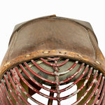 Load image into Gallery viewer, Close-up of a vintage leather-covered fan or vent with red metal wire guards and distressed paint, shown against a plain white background.
