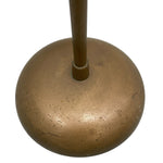 Load image into Gallery viewer, Close-up of a round bronze metal base with a vertical stem rising from the center, shown against a plain white background.
