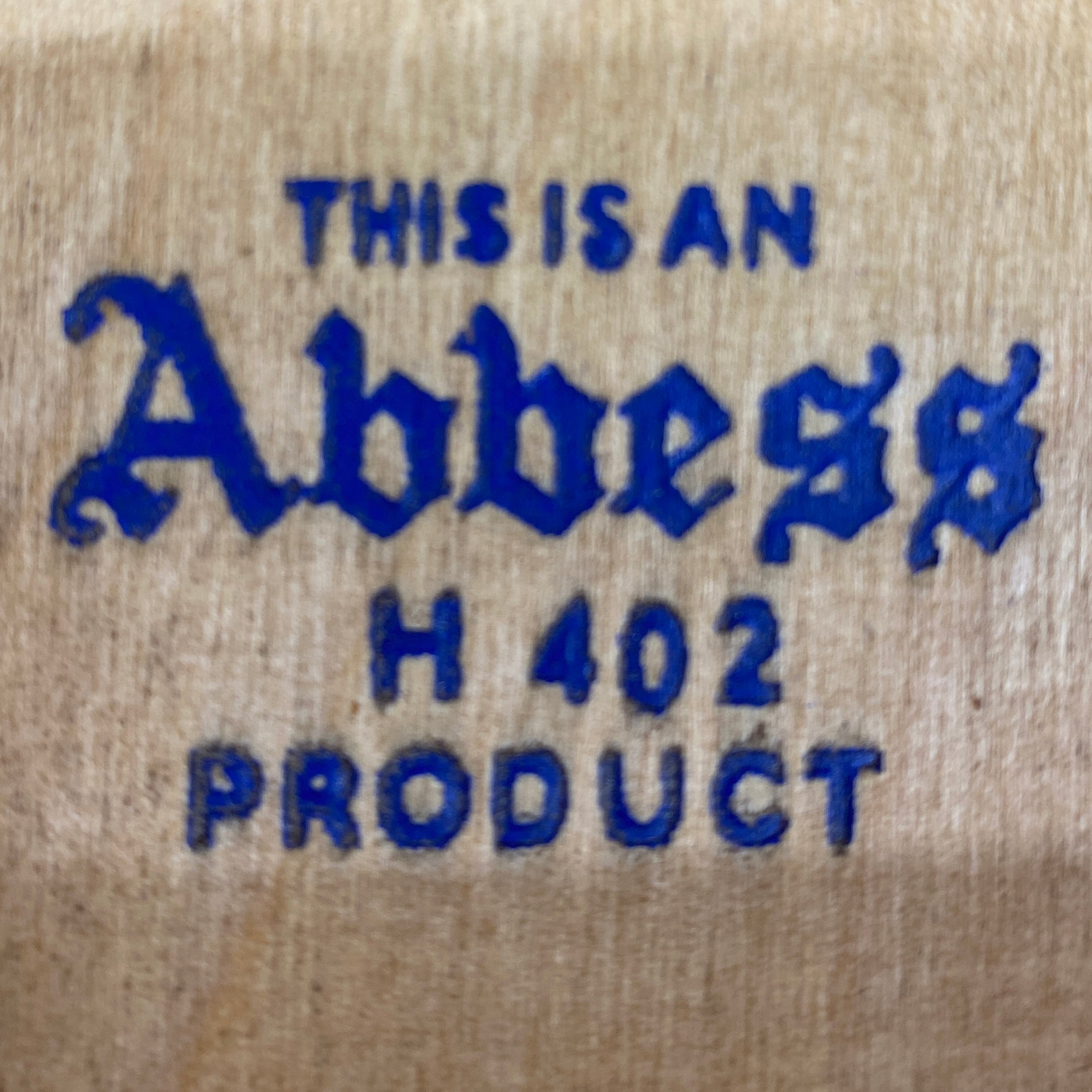 Text 'THIS IS AN Abbess H 402 PRODUCT' on a beige background