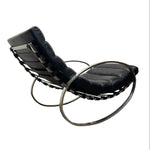 Load image into Gallery viewer, A mid-century modern lounge chair with black leather cushions and a polished chrome metal frame, shown against a plain white background.
