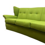 Load image into Gallery viewer, A bright lime green upholstered sofa shown from a low angle against a plain white background.
