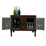 Load image into Gallery viewer, A rustic dark brown wooden bar cabinet with two doors swung open, displaying beer bottles inside, topped with three green glass soda bottles on a white background.
