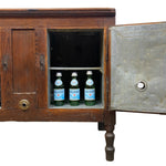 Load image into Gallery viewer, A vintage wooden cabinet with an open door showing three green Pellegrino bottles inside, set against a plain white background.
