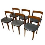 Load image into Gallery viewer, Six mid-century modern dining chairs with warm medium-brown wood frames and dark gray upholstered seats, arranged on a plain white background.
