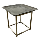 Load image into Gallery viewer, A square side table featuring a textured, metallic gray top and a polished brass-finished metal frame base, shown against a plain white background.
