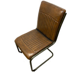 Load image into Gallery viewer, A brown faux leather dining chair with a ribbed backrest and seat, supported by a black metal cantilever frame, shown against a plain white background.
