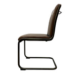 Load image into Gallery viewer, A side-view shot of a modern cantilever dining chair with a dark brown leather seat and backrest, supported by a black metal frame, isolated on a white background.
