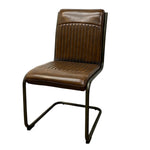 Load image into Gallery viewer, A brown leather dining chair with a ribbed backrest and seat, supported by a black cantilever metal frame, shown against a plain white background.
