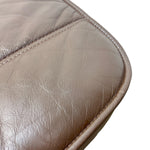 Load image into Gallery viewer, Close-up of a brown leather item showing the texture, stitching, and curved edge against a white background.

