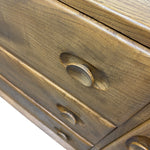 Load image into Gallery viewer, Close-up of a wooden dresser or cabinet with rounded drawer knobs, showing warm medium-brown wood grain and a glossy finish against a white background.
