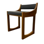 Load image into Gallery viewer, A mid-century modern wooden dining chair with a warm brown wood frame and dark gray upholstered seat and backrest, shown on a plain white background.
