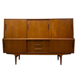 Load image into Gallery viewer, Mid-century modern wooden sideboard cabinet with a warm honey finish, featuring three upper doors, three lower drawers, and three side cabinets on a tapered wooden base with legs.

