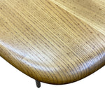 Load image into Gallery viewer, Close-up of a wooden table corner showing a smooth, rounded edge with a glossy finish and visible wood grain, isolated on a white background.
