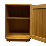 Load image into Gallery viewer, A wooden cabinet or shelf unit with an open door, showing a warm medium-brown wood grain finish and a single interior shelf, isolated on a white background.
