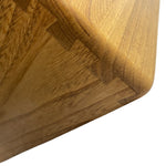 Load image into Gallery viewer, Close-up detail of a wooden cutting board corner showing a dovetail joint and natural wood grain on a white background.
