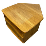 Load image into Gallery viewer, A pentagonal wooden side table or cabinet with a warm honey-toned wood grain finish, featuring a top surface, one front drawer with round knobs, and an open shelf, shown on a plain white background.
