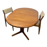 Load image into Gallery viewer, A mid-century modern wooden dining set featuring an oval table with a star base and two matching chairs with beige upholstered seats, shown on a plain white background.
